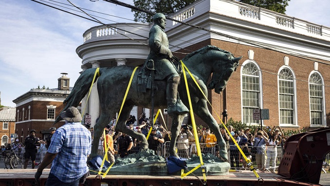 Workers haul away the statue of Confederate General Robert E. Lee from Market Street Park in Charlottesville, Virginia, USA, 10 July 2021. Image credit: EPA