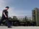 Russian military official walks in front of the S-400 missile system